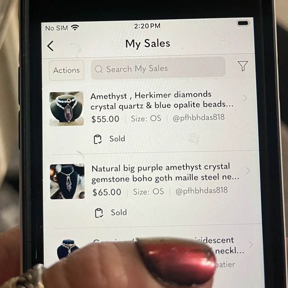 Two nevklaces from shop 2 . On hold